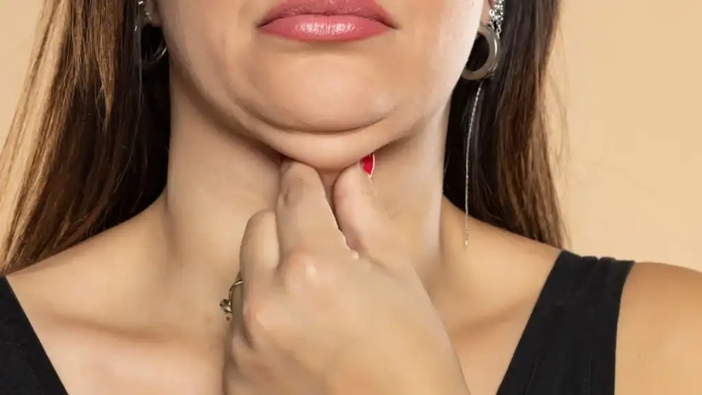 An image of a woman with double chin, sad, worried : Non Surgical Double Chin Removal Treatment in Ledbury, UK